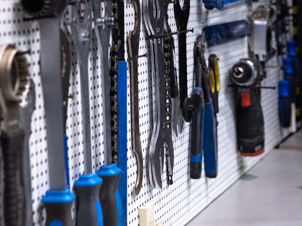 Hand tools hanging on a workshop wall